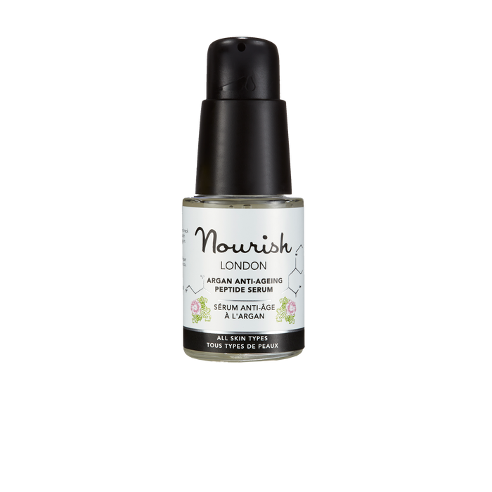 Nourish London Argan Anti-Ageing Peptide Serum in a small 15ml pump bottle, photographed on a black background, suitable for all skin types.
