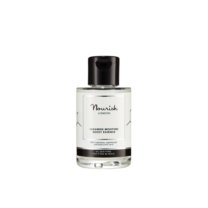 A clear bottle of Nourish London Ceramide Moisture Boost Essence with a black cap, displayed against a white background.