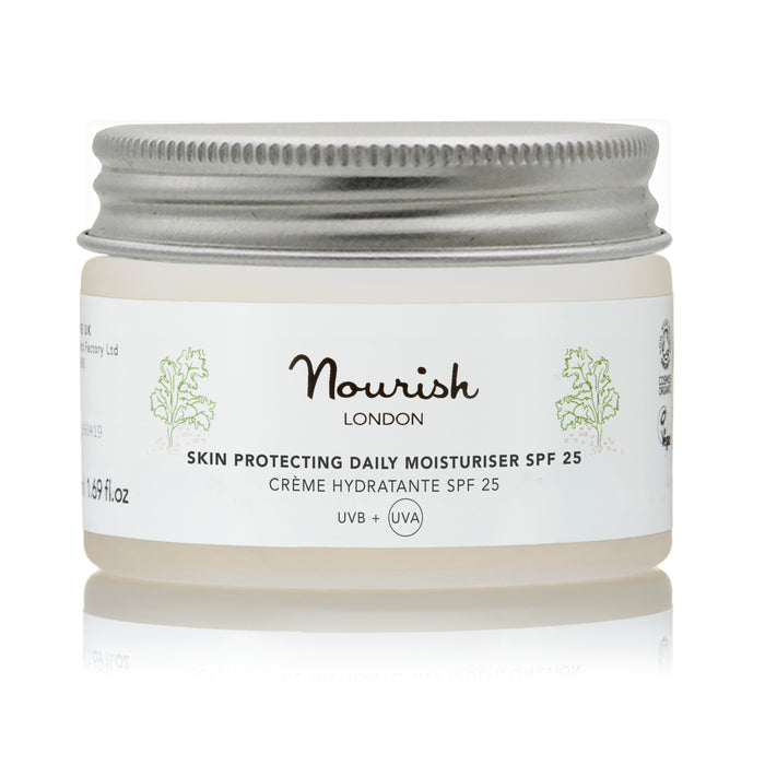 A jar of Nourish London Skin Protecting Daily Moisturiser SPF 25 with a silver lid, displayed against a white background